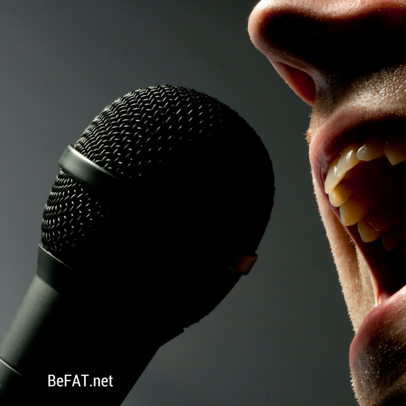 person singing into microphone.jpg